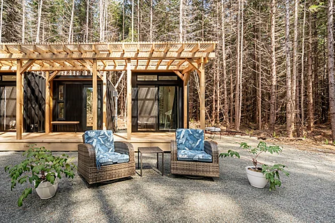Living room with a vaulted timber ceiling and forest views, Cobble Hill real estate photography