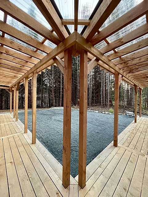 Timber-frame covered deck framed against the forest, Cobble Hill real estate photography