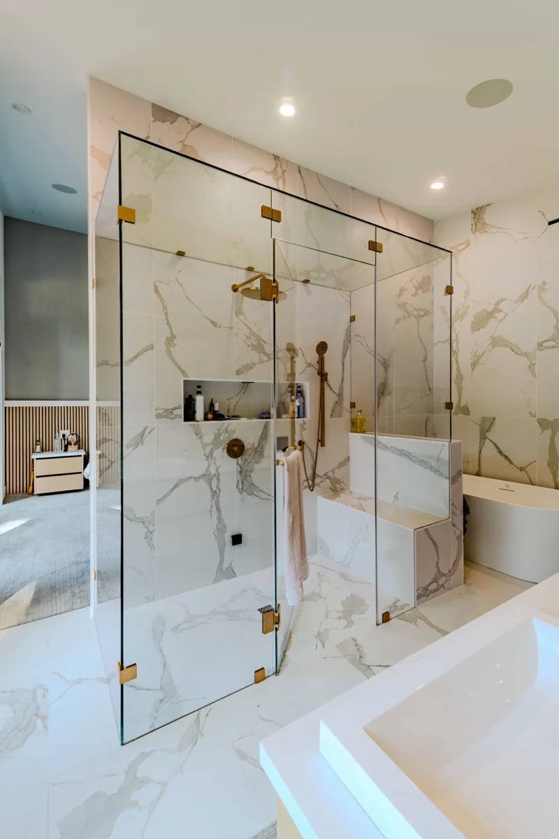 Luxury marble ensuite bathroom with gold fixtures
