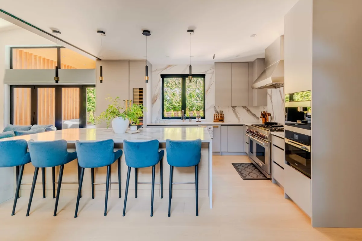 Luxury kitchen with marble island and blue barstools