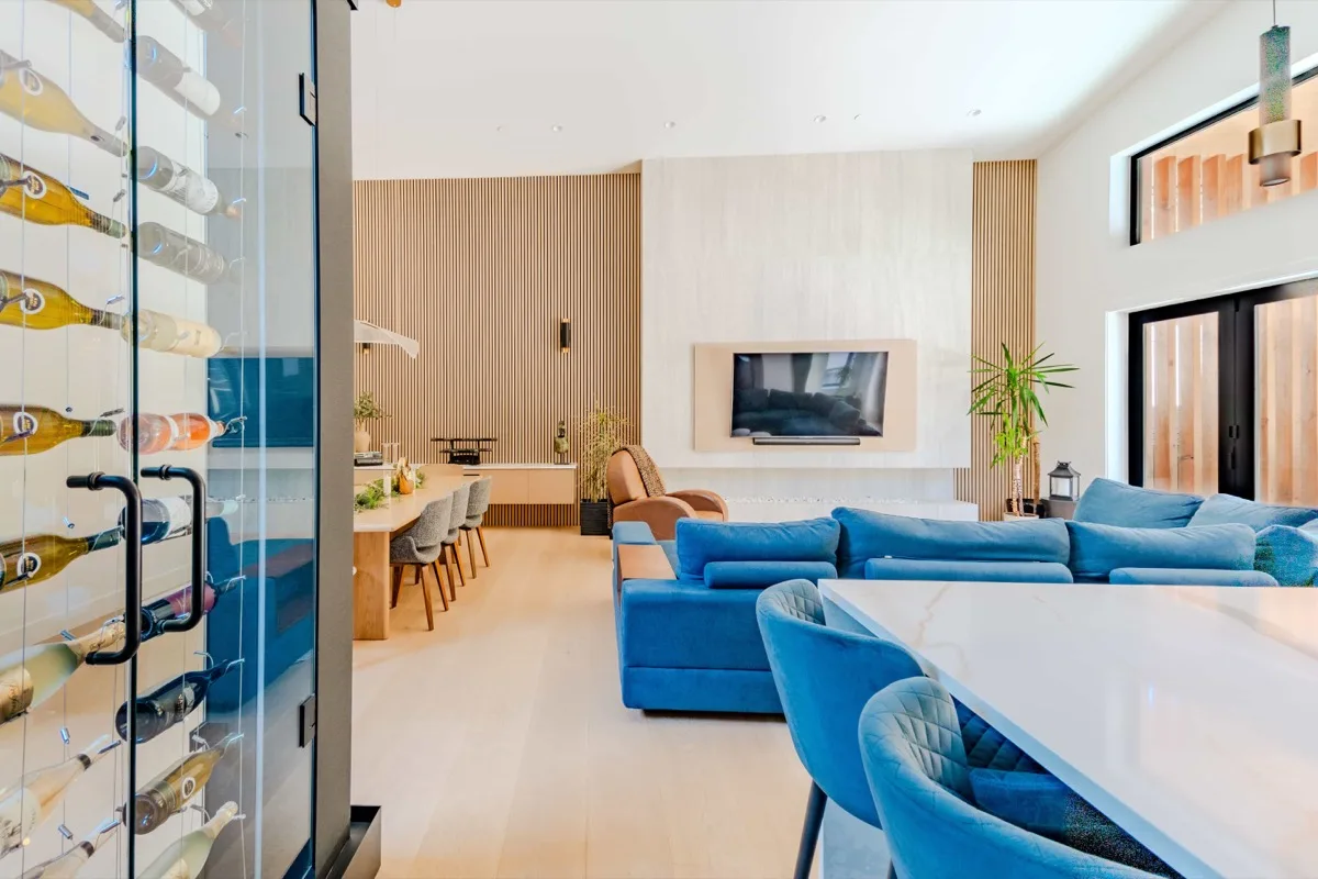 Open-plan living area with wine wall, video tour frame